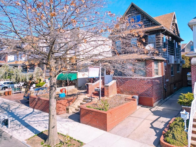 view of front of property featuring brick siding