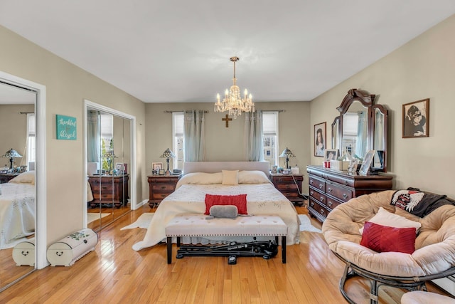 bedroom featuring a notable chandelier and hardwood / wood-style floors