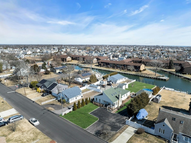 aerial view with a residential view and a water view