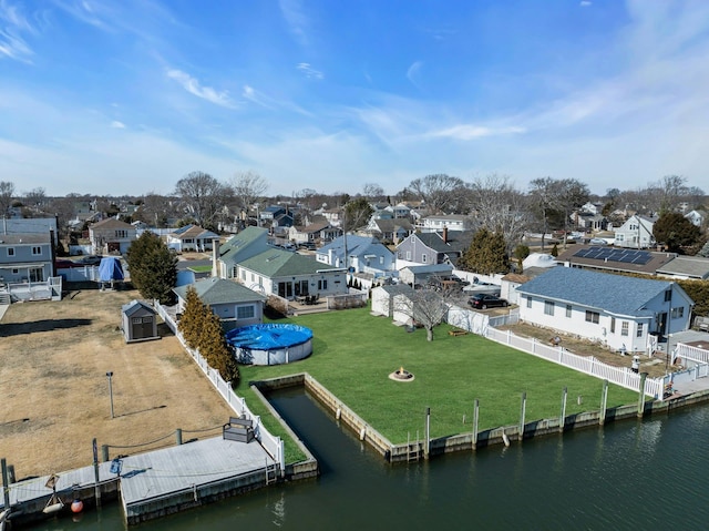 bird's eye view featuring a water view and a residential view