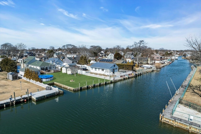 drone / aerial view featuring a residential view and a water view