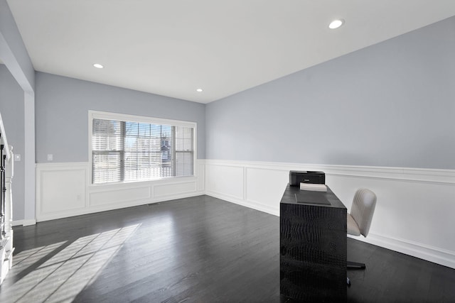 office space with recessed lighting, dark wood-type flooring, and wainscoting