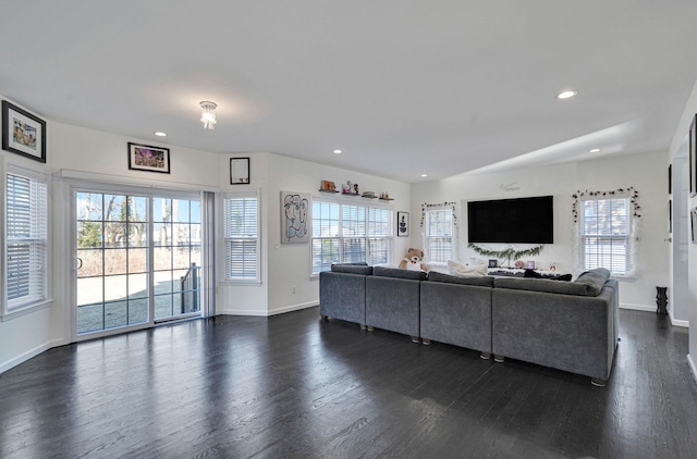 living area with dark wood finished floors, recessed lighting, and baseboards