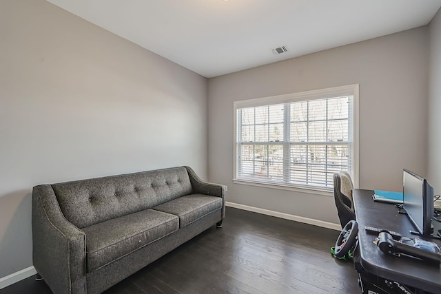 office area with visible vents, baseboards, and dark wood-style floors