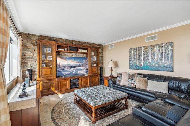 living area featuring light tile patterned flooring, visible vents, and ornamental molding