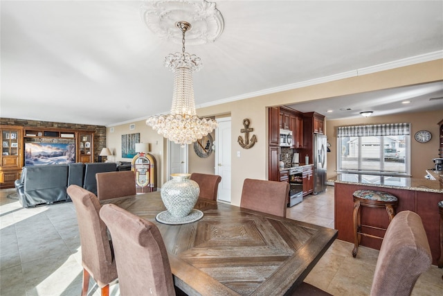 dining space with an inviting chandelier, light tile patterned floors, and crown molding