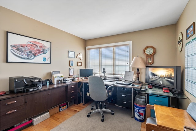 home office with light wood-style floors