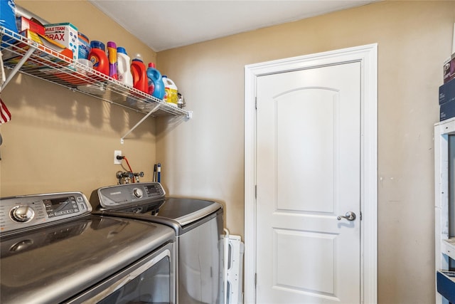 laundry room featuring laundry area and separate washer and dryer