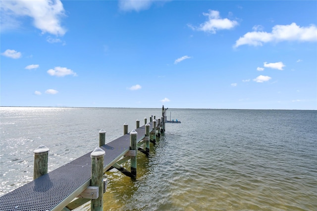 dock area with a water view and boat lift