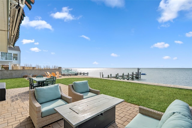 view of patio / terrace with an outdoor living space with a fire pit, a water view, a dock, outdoor dining area, and boat lift