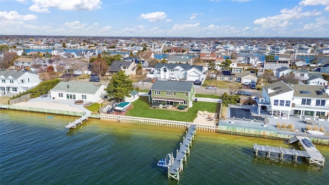 bird's eye view with a residential view and a water view