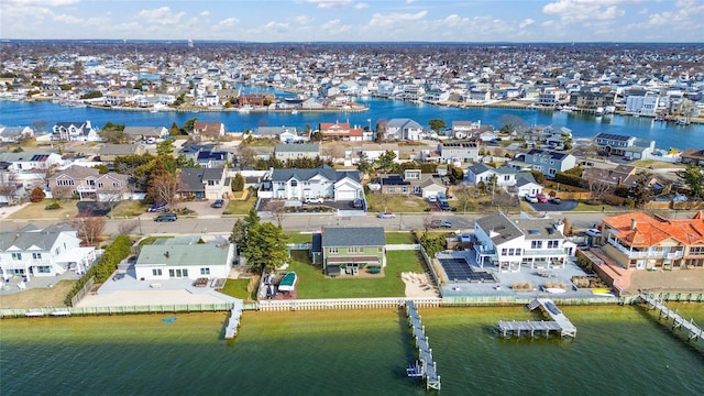 bird's eye view featuring a water view and a residential view