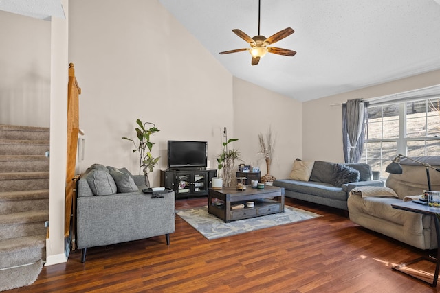 living room with high vaulted ceiling, ceiling fan, stairway, and wood finished floors