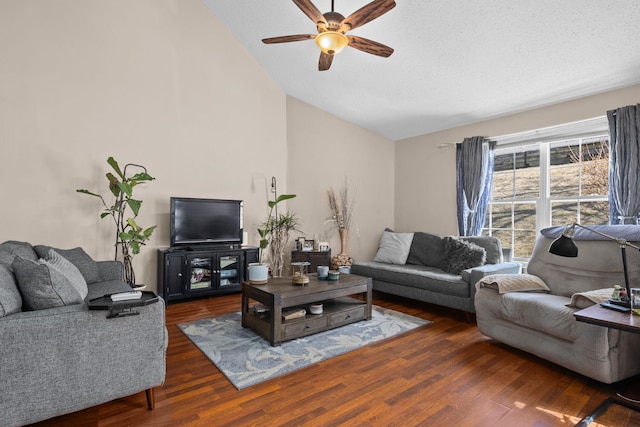 living room with a ceiling fan, high vaulted ceiling, and wood finished floors