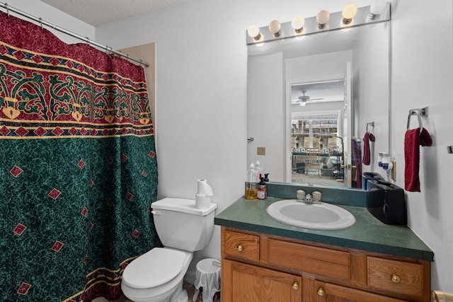 bathroom featuring a shower with curtain, toilet, a textured ceiling, and vanity