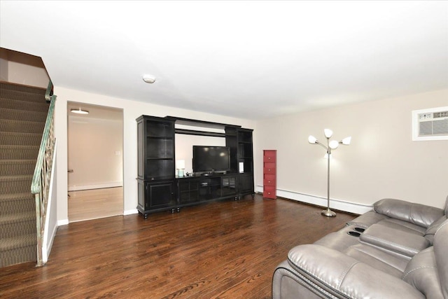 living area with baseboards, dark wood-style floors, stairway, a baseboard heating unit, and a wall mounted AC