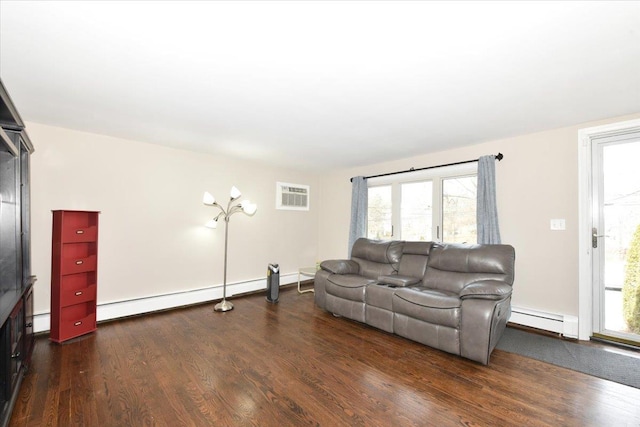 living area featuring a baseboard heating unit, baseboard heating, and wood finished floors