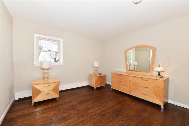 sitting room with dark wood-style floors, baseboards, and baseboard heating