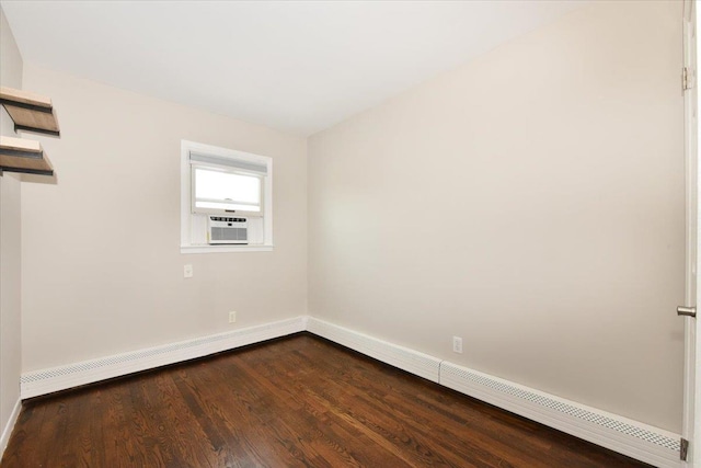 unfurnished room with dark wood-style flooring, a baseboard radiator, cooling unit, and baseboards