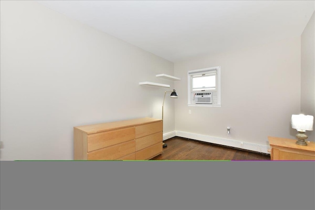 bedroom with dark wood-type flooring, cooling unit, a baseboard heating unit, and baseboards