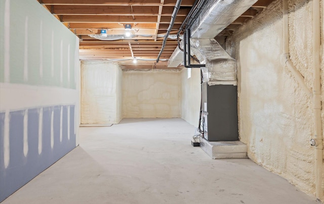 unfinished basement with heating unit