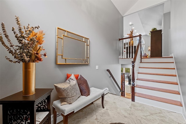 staircase featuring high vaulted ceiling