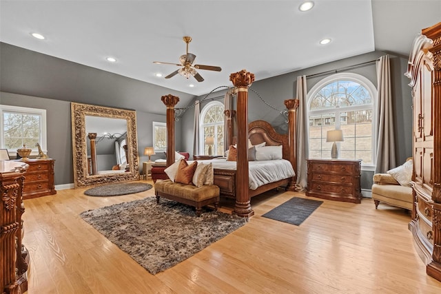 bedroom featuring recessed lighting, baseboards, lofted ceiling, and light wood-style flooring