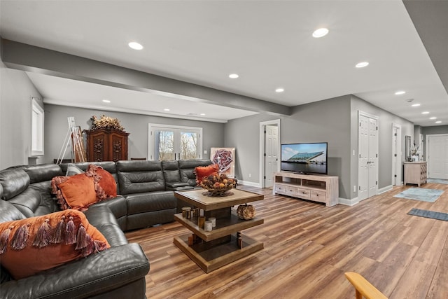 living room featuring light wood finished floors, recessed lighting, french doors, and baseboards