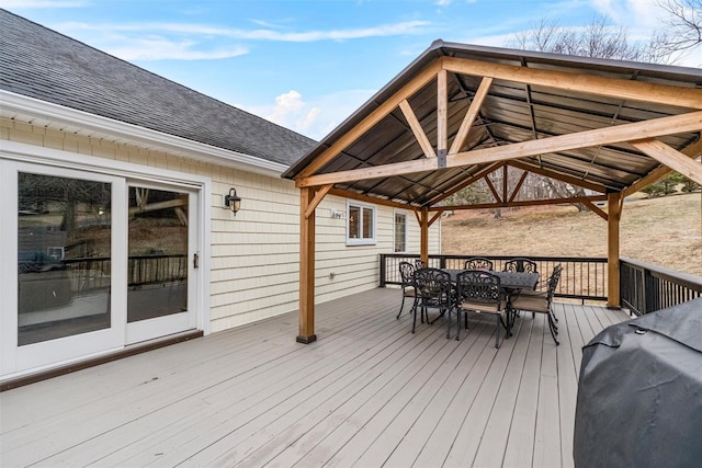 deck with a gazebo, a grill, and outdoor dining area