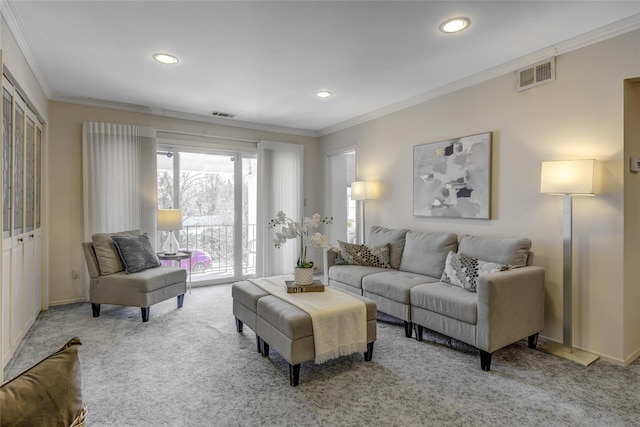 living area with light carpet, visible vents, crown molding, and recessed lighting