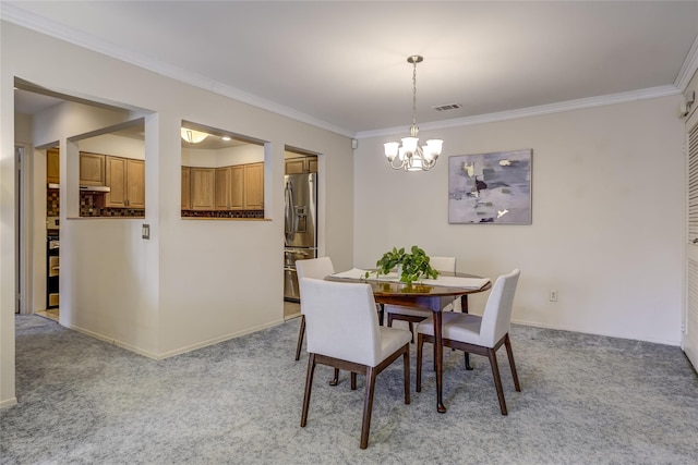 dining room with visible vents, ornamental molding, and light colored carpet