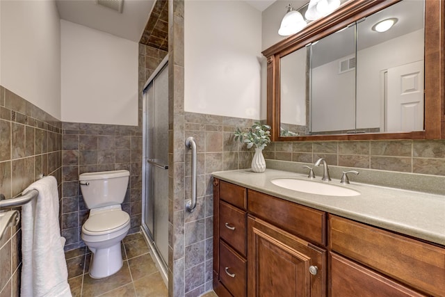 full bath with a shower stall, visible vents, tile walls, and toilet