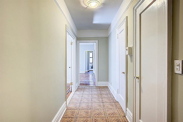 hallway featuring baseboards