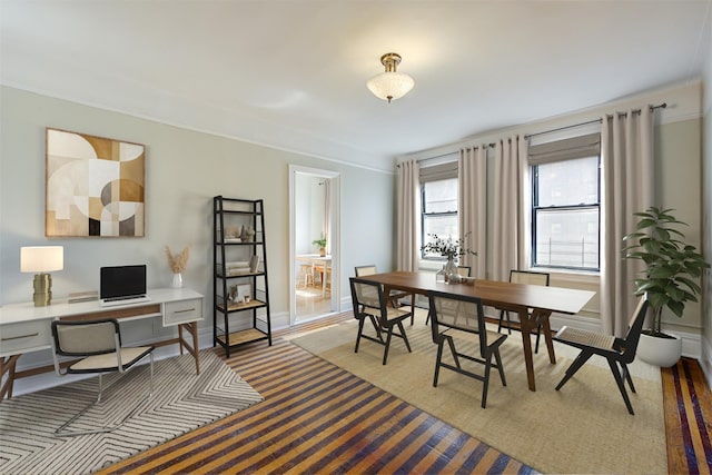 dining room featuring an office area and crown molding