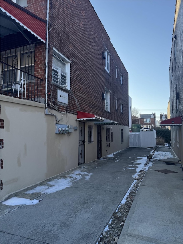 view of side of property with brick siding