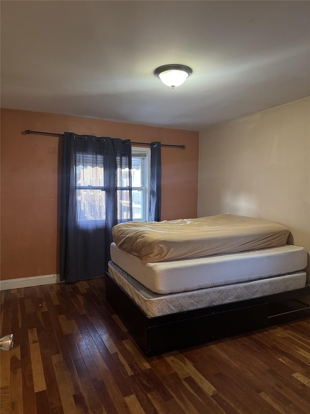 unfurnished bedroom with wood-type flooring