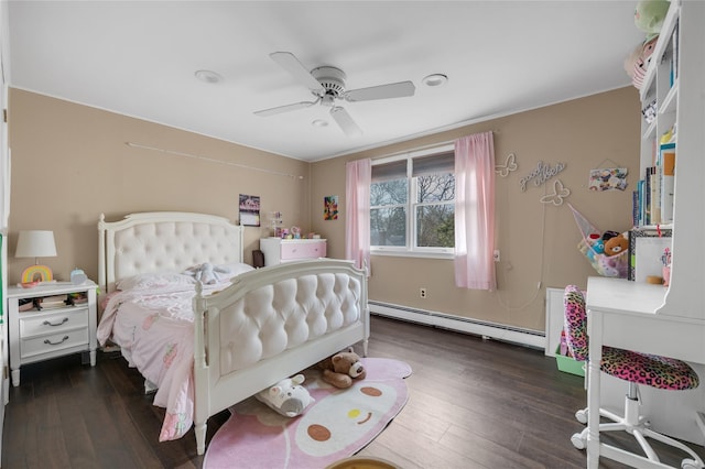 bedroom with ceiling fan, wood-type flooring, and a baseboard radiator