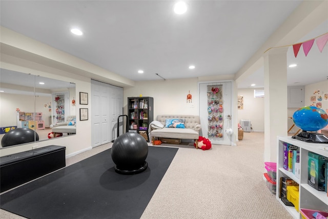 exercise room with recessed lighting and carpet floors