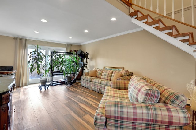 living room featuring recessed lighting, stairway, ornamental molding, a baseboard heating unit, and wood finished floors