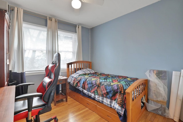 bedroom featuring ceiling fan and wood finished floors