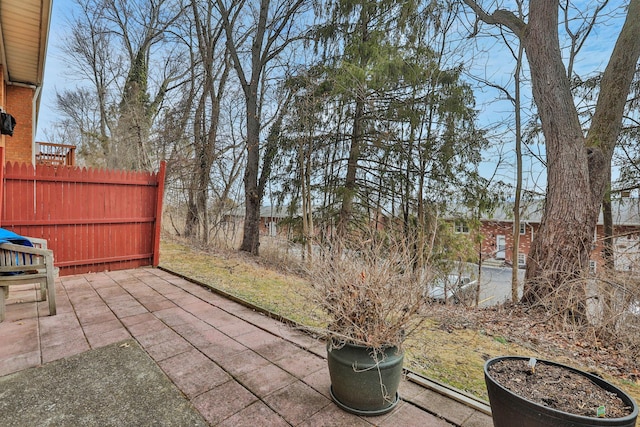 view of patio / terrace featuring fence