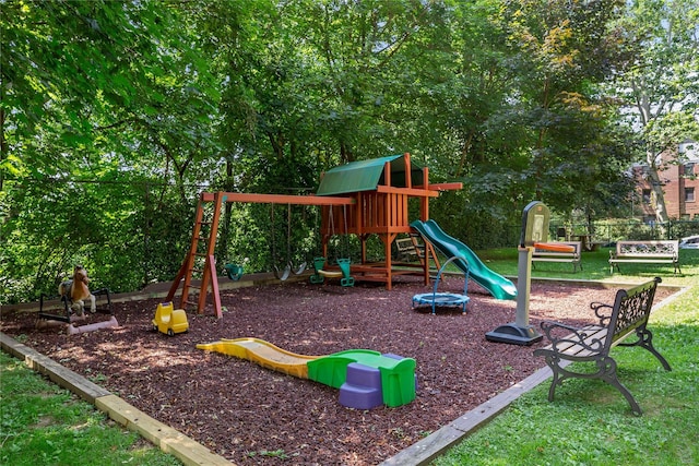 communal playground featuring a lawn