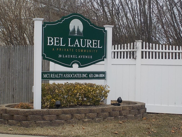 community sign with fence