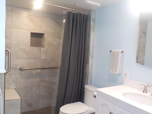 full bath with a shower stall, toilet, and vanity