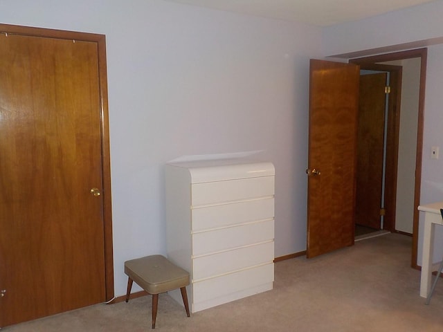 bedroom featuring baseboards and carpet flooring