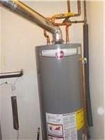 utility room featuring water heater