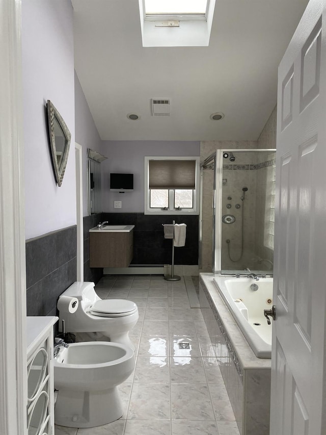 full bathroom featuring visible vents, a bidet, a tile shower, vanity, and tiled tub