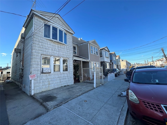 view of road with sidewalks and a residential view