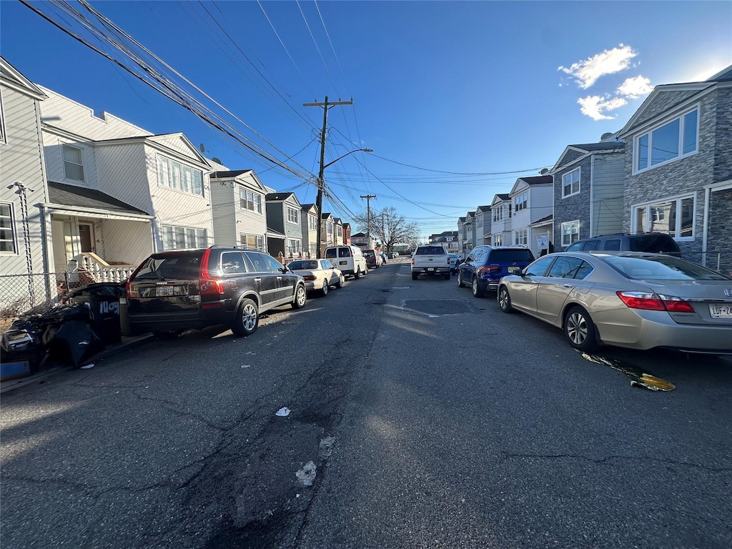 view of street with a residential view and street lights