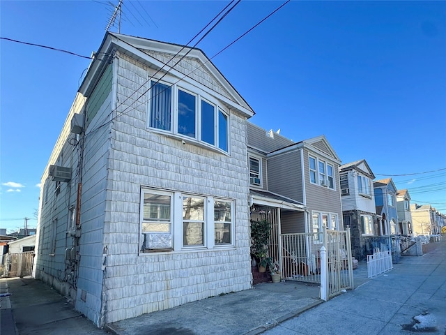 exterior space featuring fence and a residential view